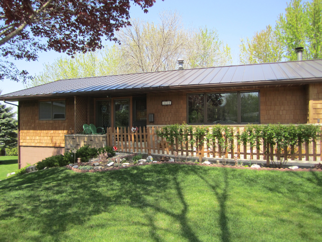 Finished green steel roof on a residential property